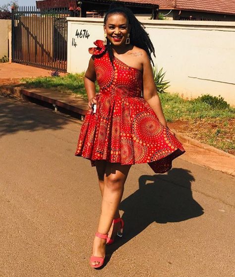 Lady In Beautiful Red One Arm Shweshwe Short Flared Dress - Clipkulture | Clipkulture One Hand Dress, Sotho Traditional Dresses, Short Flared Dress, South African Traditional Dresses, African Traditional Wear, Hand Dress, Shweshwe Dresses, Traditional African Clothing, Ankara Gowns