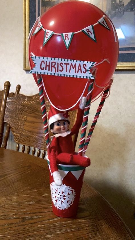 #elfontheshelf #hotairballoon #merrychristmas #elf #easyelfontheshelfideas #elfontheshelfideas Elf On The Shelf Arrival Ideas Hot Air Balloon, Elf On The Shelf Hot Air Ballon, Elf Parachute Diy, Diy Elf Hot Air Balloon, Elf On The Shelf Cold Weather, Elf On A Shelf Balloon Ideas, Elf On Shelf Hot Air Balloon, Elf On The Shelf Hot Air Balloon Arrival, Hot Air Balloon Elf On The Shelf