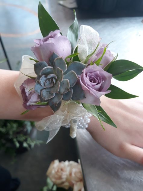 Wedding wrist corsage using lavender spray roses, ruscus, and succulents. Made at Oberer's Flowers in Cincinnati. Wedding Coursage, Lavender Corsage, Floral Wrist Corsage, Succulent Corsage, Wedding Wrist Corsage, Prom Flowers Corsage, Using Lavender, Homecoming Flowers, Wrist Corsage Prom