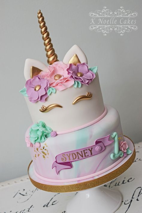 Unicorn themed 1st birthday cake with marbled fondant and sugar flowers by K Noelle Cakes Unicorn Cake Pastel Colors, Unicorn Cake 2 Layer, Marbled Fondant, Unicorn Cake Design, Unicorn Desserts, Unicorn Birthday Party Decorations, Themed 1st Birthday, Unicorn Themed Birthday Party, Gold Drip