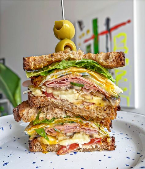 The Best Mortadella Sandwich cut in half and stacked on top of each other with a toothpick and 2 stuffed olives on top Mortadella Sandwich, Pickled Cucumber Salad, Brunch Burger, Sandwich Sauces, Easy Egg Recipes, Italian Sandwich, Fried Mushrooms, Sandwich Ingredients, Vegan Sauces