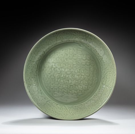 <p>Property from the Collection of the Late John Turner (1901-1971)</p><p>A large Longquan celadon-glazed 'diaper' dish</p><p>Ming dynasty</p><p><br></p><p>Diameter 46.3 cm, 18¼ in.</p><p>__________________________________________________________________________</p><p><br></p><p>Collection John Turner (1901-1971)</p><p>Grand plat en grès céladon 'Longquan', dynastie Ming</p><p>__________________________________________________________________________</p><p><br></p><p>John Turner (1901-1971) 14th Century Art, Longquan Celadon, Dragon Incense Burner, Glazed Bowl, White Pencil, Korean Art, Ming Dynasty, Chinese Ceramics, Russian Art