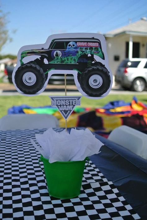 Hand made grave digger centerpiece Grave Digger Centerpiece, Grave Digger Pinata, Monster Jam Centerpieces, Grave Digger Birthday Cake, Grave Digger Birthday Party, Party Centerpiece Ideas, Monster Truck Theme Birthday Party, Monster Jam Birthday Party, Digger Birthday