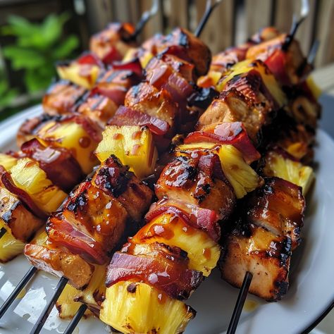 🍍 Tropical on a stick: Hawaiian Chicken Bacon Pineapple Kebabs! #TropicalTaste Hawaiian Chicken Bacon Pineapple Kebabs Ingredients: Chicken breasts, cubed Bacon slices Pineapple chunks BBQ sauce Instructions: Wrap chicken in bacon, thread on skewers with pineapple. Grill, basting with BBQ sauce. 🍢🥓 Experience the flavors of Hawaii with every bite. Perfect for your next BBQ! Ignite your grill and share with #KebabKraze! Bbq Chicken Kebabs On The Grill, Bbq Squers, Pitboss Recipes, Pineapple Grill, Hawaiian Chicken Skewers, Bacon Sticks, Chicken Skewers Grilled, Kebabs Skewers, Pineapple Chicken Kabobs