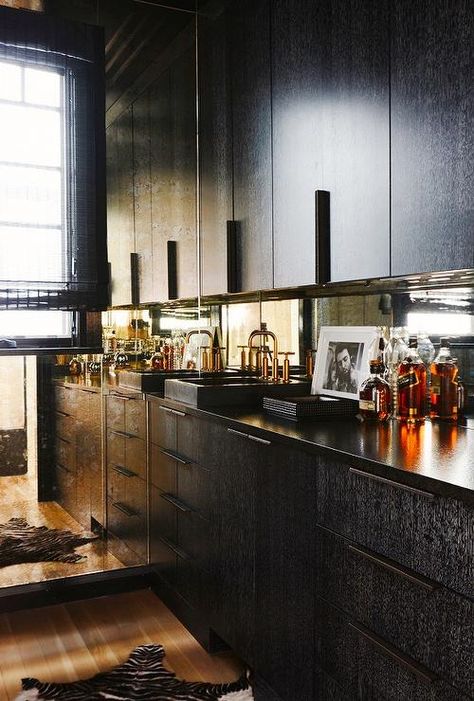 Basement Bar? Contemporary room features black flat front cabinets paired with dark black countertops fitted with a black overmount sink and gold gooseneck faucet and a mirrored backsplash alongside a black and white zebra cowhide rug. Flat Front Cabinets, Slab Cabinets, Brooklyn House, Farmhouse Backsplash, Mirror Backsplash, Black Countertops, Herringbone Backsplash, Diy Backsplash, Backsplash Designs