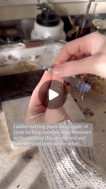 Silverjewellry Community on Instagram: "@willowandtwigg This is the method I use to solder posts to earrings! ⚒️  For a long time I used to use serrated tweezers clamped in a ‘third hand’ holder, but found it really fiddly to get them into position and to apply the right amount of pressure.  These smaller tweezers are stainless steel (so won’t rust) and the smooth jaws make it really easy to gently tilt the post and align it to the angle I need.  They’re not necessarily secure enough to hold larger soldering tasks like ring shanks, but earring posts are really light and delicate so they don’t need to be strongly held and I find this is just enough to keep them in place.  The bulldog clip on the end uses gravity and balance to hold the posts down whilst soldering; I just take care to make s Bulldog Clip, School Inspiration, Three Hands, Earring Posts, Tweezers, Soldering, Clip On, Post Earrings, Gravity