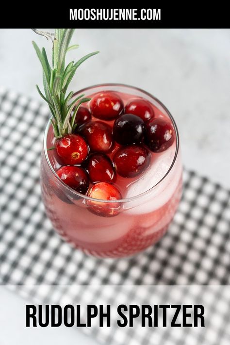 Drink with cranberries on top and rosemary out of the glass on a grey plaid napkin on a concrete back drop. Cranberry Ginger Ale, Holiday Punch, Holiday Drink, Non Alcoholic Cocktails, Alcoholic Cocktails, Christmas Cocktail, Rum Drinks, Holiday Cocktail, Recipe Board