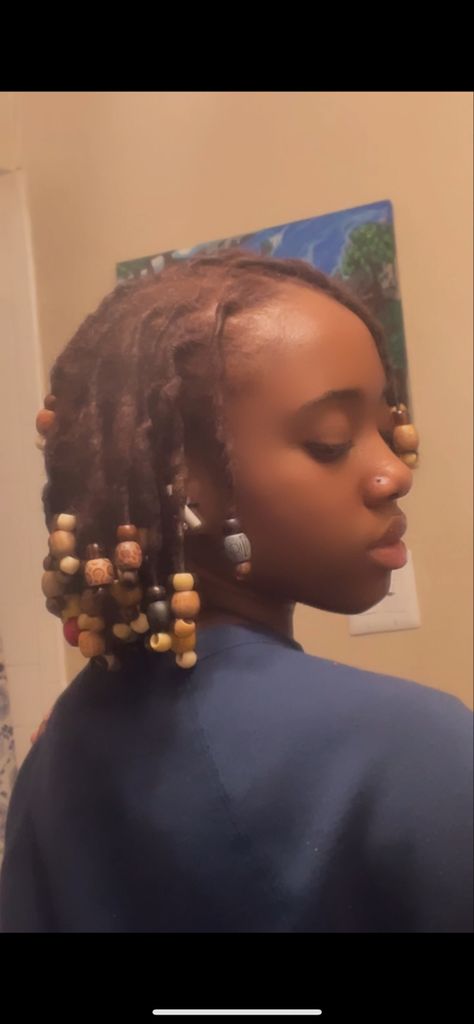 Hairstyles With Wooden Beads, Short Loc Styles With Beads, Locs With Wooden Beads, Beads On Starter Locs, Beads On Short Locs, Locs With Beads And Shells, Wooden Beads Hairstyles, Locs Side Profile, Beads In Locs