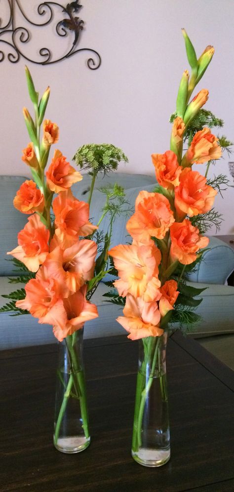 Love these orange gladiolus with queen's anne lace for centerpieces Gladiolus Flower Arrangements Wedding, Flower Arrangements With Gladiolus, Gladiolus Wedding Centerpiece, August Wedding Flowers Centerpieces, Gladiolus Arrangements Vase, Gladioli Flower Arrangements, Gladiola Centerpiece, Gladiola Bouquet, Gladiolus Bridal Bouquet