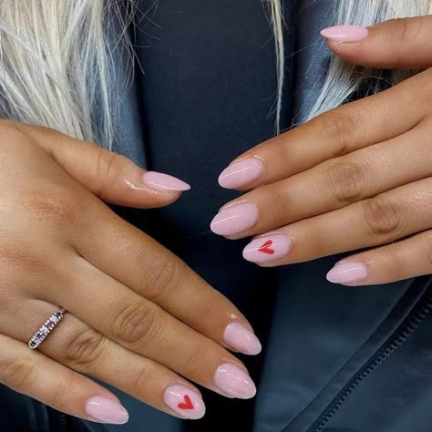 Simple Almond Nail Designs Classy, Pink Nails With Love Heart, Valentines Day Nails Heart On Ring Finger, Valentine’s Short Nails, Pink Valentines Nails Ideas, Super Simple Valentines Nails, Pink Short Almond Acrylic Nails, Valentines Nails 2024 Short, Valentine’s Day Nail Inspiration