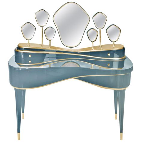 Following the Amélie dressing table, Petit Amélie was born as an expression of mysticism and magic. Dona Maria Amélia was a princess of the Empire of Brazil and a member of the Brazilian branch of the House of Braganza. This lovely, smaller version is structured in lacquered wood with gold leaf coated details. Reflecting the seven secrets of Portugal’s last queen’s eternal beauty, it is adorned with seven different-sized mirrors. This dressing table's legs in lacquered wood finished with high gl Dressing Room Decor, Dressing Table Desk, Deco Bedroom, Brass Wood, Lacquered Wood, Dressing Tables, Solid Wood Dining Table, Dream House Decor, Wood Dining Table