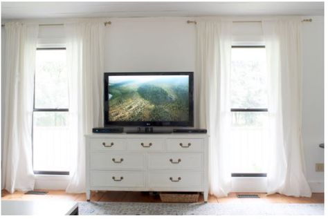 From The Nester's Cozy Minimalist class. The way she has her TV on a chest between two windows is just like our setup! Curtains hung high and wide make a huge difference! Myquillyn Smith, Cozy Minimalist Home, Cottage Style Furniture, Window Curtains Bedroom, Cozy Minimalist, Window Room, Her Book, Living Room Windows, Lounge Room