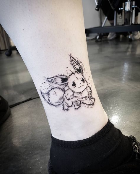 Mary J on Instagram: “Adorable Eevee done yesterday! Always love doing Pokemon tattoos 😍 eventually id love get to do all original 151! @east_end_tattoo •…” Small Eevee Tattoo, Simple Pokémon Tattoo, Eevee Tattoo Ideas, Eevee Tattoo Design, Eevee Pokemon Tattoo, Pokemon Tattoo Sleeve, Matching Pokemon Tattoos, Jolteon Tattoo, Pokemon Flash Tattoo