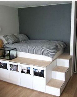 If you want extra storage, a raised bed is the way to go. Nine sturdy IKEA kitchen cabinets hold personal items. #KingSizeBed Diy Seng, Diy Storage Bed, Murphy Bed Ikea, Diy Platform Bed, Murphy Bed Plans, Bed Platform, Ikea Bed, Platform Bed With Storage, Kids Bunk Beds