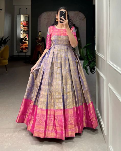 👉 Price- 1099/-+ shipping 👈 *🌷Kanjivaram Gown🌷* A joyful festive mood with Kanjivaram and zari weaving work appliqued gown 🌼 *Gown (Stitched)* 👉🏿Gown Fabric : Kanjivaram 👉🏿Gown Work : Zari Weaving Work 👉🏿Chest : 40" (Inside 2 inch extra margin available so you can adjust support up to 42 for your body comfort ) 👉🏿Waist : 38" 👉🏿Length : 56" 👉🏿Flair : 3.50 Meter 👉🏿Sleeve length : 13 👉🏿Lining : silk (full upto bottom) Code- H50 Pattu Long Frocks For Women Latest, Frock Models For Women, Pattu Long Frocks For Women, Latest Long Frock Designs, Saree Dress Design Ideas, Long Frocks For Women, Blue Color Dress, Frocks And Gowns, Simple Frock Design