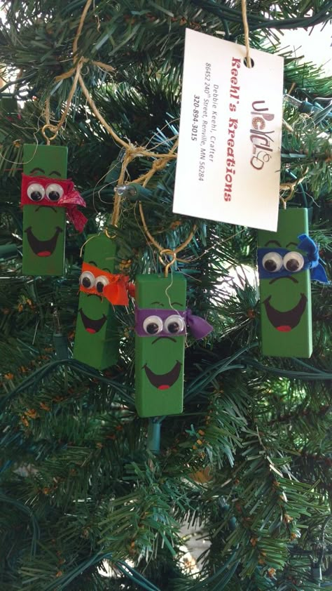 TMNT Christmas tree ornaments made from Upcycled Jenga game blocks. Jenga Wood Crafts, Jenga Crafts Ideas Christmas, Crafts Made With Jenga Blocks, Mini Jenga Block Crafts Christmas, Jenga Reindeer Ornaments, Jenga Christmas Crafts, Upcycle Jenga Blocks, Jenga Ornaments, Jenga Block Painting Ideas