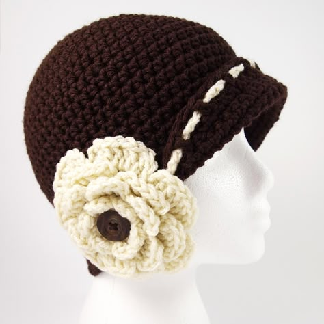 Are you in love with all things retro and vintage? If so, you'll love the Vintage Flower Cloche Hat Crochet Pattern - it's straight out of the roaring '20s! Featuring a slight brim and a gorgeous oversized flower on the side, this gorgeous design will be the perfect finishing piece for all of your spring and summer outfits. Cloche Hat Crochet, Flower Cloche, Cloche Hat Pattern, Crochet Hat With Brim, Crochet Caps, Crochet Summer Hats, Crochet Hat For Women, Hat Patterns Free, Cloche Hats