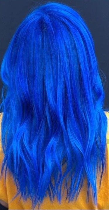 Blue hair is often considered cool due to its association with uniqueness, self-expression, and a departure from conventional norms. The striking and unconventional color stands out from the crowd, making a bold statement that the individual is willing to break away from traditional hair colors. Vibrant Blue Hair Color, Cobalt Blue Hair Color, Bright Blue Hair Color, Blue Hair Bright, Vivid Blue Hair, Royal Blue Hair Color, Shades Of Blue Hair, Neon Blue Hair, Cobalt Blue Hair