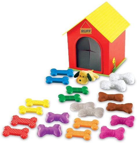 Fun Tactile Set⁠ A Fun Tactile Set to explore different textures with this engaging sensory play activity set as they help Ruff the dog find all of the textured bones hidden in his kennel. Dog-themed activity set encourages tactile awareness while developing fine motor skills. Includes pairs of rubber and cloth bones in a variety of textures: smooth, silky, scratchy, bumpy, ribbed, woolly and more. Includes one cloth dog, 20 bones (two each of ten textures), plastic doghouse and Activity Guide. Senses Activity, Gift Ideas For Parents, Communication Development, Tactile Sensory, Visual Impairment, Holiday Gift List, Free Toys, Sensory Integration, 5 Senses