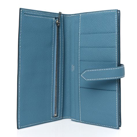 This is an authentic HERMES Epsom Bearn Gusset Wallet Blue Jean. This lovely wallet is crafted of textured epsom calf leather with a prominent palladium silver H with a strap closure. The wallet opens to a matching leather interior with card slots, bill pockets, and a zipper pocket.