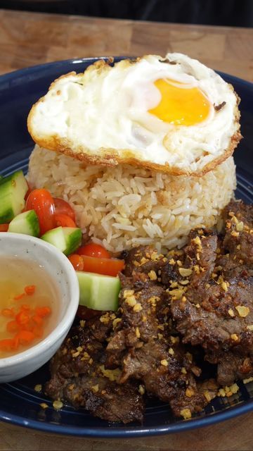 Leah Cohen 🇺🇸🇵🇭 on Instagram: "Never met a silog I didn’t like and Tapsilog is definitely up there for me. If you are unfamiliar with Silog it is essentially garlic fried rice, a fried egg and some sort of protein. Beef tapa is essentially a cured beef which is where the name tapa comes from which means either preserved, smoked or cured. Silogs are often eaten for breakfast (good way to utilize leftovers) but honestly it’s so damn good and filling you can eat it any time of day. What’s your favorite Silog? 🇵🇭

Beef Tapa marinade:
-1/2 lb thinly sliced beef (I used flank) 
-1.5 Tbs soy sauce 
-1.5 Tbs vinegar
-1/2 Tbs sugar
-2 Tbs minced garlic
-1Tbs neutral oil + 1.5Tbs for pan frying
-Black pepper to taste
-Pinch salt 
Marinate 12 hours" Cured Beef, Beef Tapa, Garlic Fried Rice, Pan Frying, Fried Egg, Minced Garlic, Black Pepper, Fried Rice, Soy Sauce