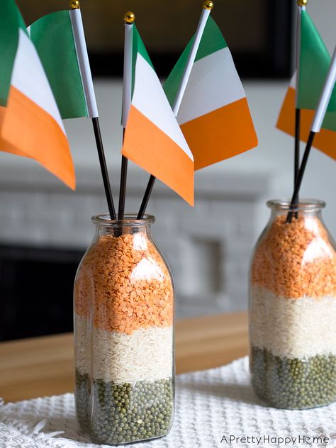 St. Patrick's Day centerpiece using lentils, rice, milk bottles and the Irish flag. Irish Theme Party, Irish Decorations, Ireland Party, San Patrick Day, Irish Birthday, Fete Saint Patrick, Irish Theme, Irish Party, Irish Folklore