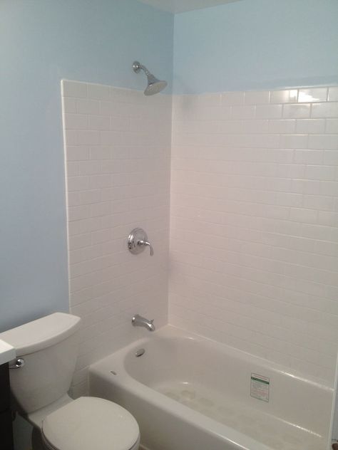 Every time I walk into the new bathroom we installed I know there is no way water will get behind the new subway tiles. It's reassuring to know that the bathtub… Bathtub Wall Surround, Bathtub Wall, Beadboard Bathroom, Diy Bathtub, Faux Fireplace Diy, Diy Bathroom Makeover, Bathtub Walls, Diy Nightstand, Tub Surround