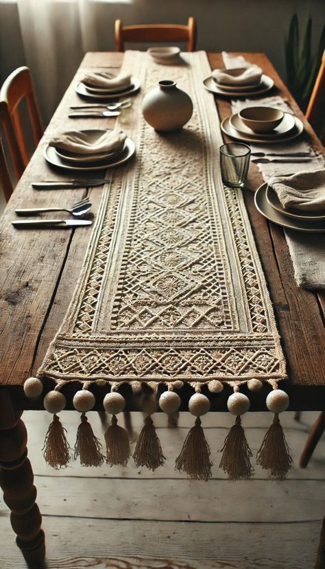 A beautifully set rustic dining table featuring a boho-inspired macramé table runner with tassel details, creating a cozy and inviting atmosphere for gatherings.  #BohoDining #RusticTableSetting #MacrameTableRunner #CozyDining #HandmadeDecor #NaturalAesthetic #BohemianStyle Rustic Table Setting, Bohemian Style Interior, Macrame Table Runner, Beige Boho, Bohemian Living Room, Style Table, Dining Living Room, Boho Interior, Rustic Dining