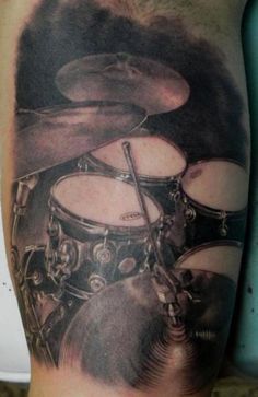 Arm Drum Realistic Tattoo by Xavi Tattoo Drumming Tattoos, Drumset Tattoo, Drum Set Tattoo, Drum Tattoos, Drummer Tattoo, Musical Tattoos, Drum Tattoo, Guitar Tattoo Design, Music Tattoo Sleeves