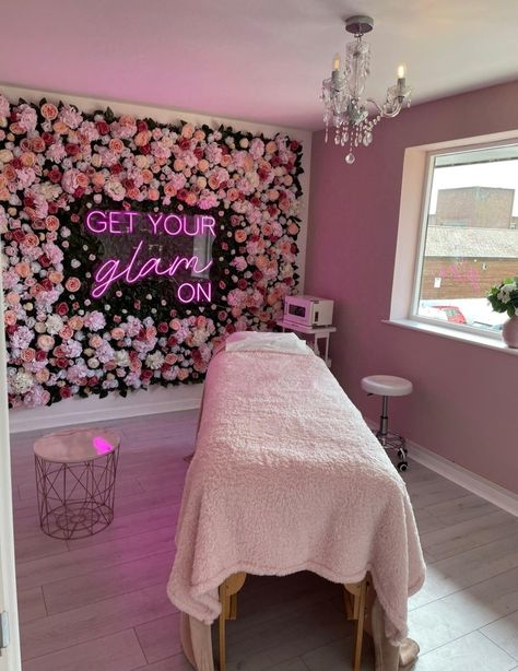 Beauty room with pink flower wall and  pink neon sign with words 'get your glam on'. Flower Wall Nail Salon, Beauty Room Inspo Interior Design, Lash Room With Desk, Beauty Room Background, Lash Room Flower Wall, Flower Wall Beauty Room, Flower Wall Beauty Salon, Girly Esthetician Room, Pink Boho Spa Room