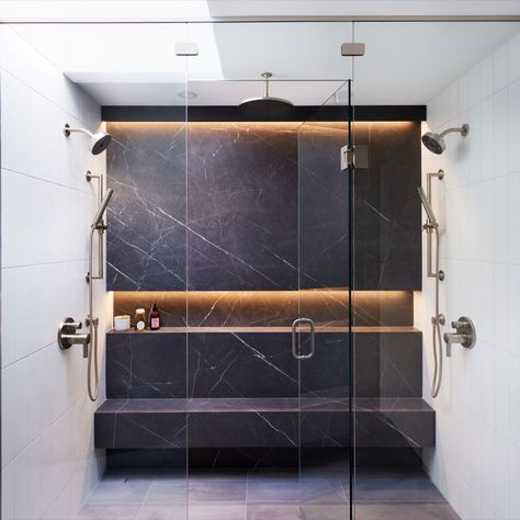 This shower has it all! It includes large porcelain slabs, intergrated lighting, a niche for products, a bench seat and one central rain head with double shower and handhelds. Double Shower Head Master Baths, Steam Showers Bathroom Master Bath, Double Shower Heads, Shower Renovation, Master Bath Shower, New House Bathroom, Shower Lighting, Double Shower, Washroom Design