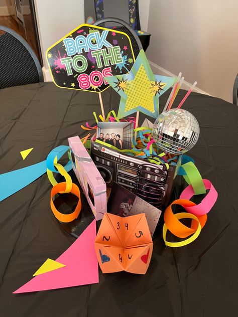 Retro Party Centerpieces, 80s Prom Table Decorations, 1980s Party Decorations Diy, 80s Table Decor, 90s Party Centerpieces, 80s Candy Bar, 80s Theme Party Decorations Centerpieces, 80s Theme Centerpieces, 80’s Centerpieces