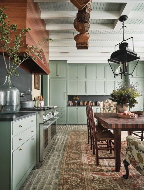 Smoky green cabinetry partners beautifully with a brick floor in this designer kitchen... #lovewhereyoulive #happyhouse #farrowandball #verticalshiplap #woodbacksplash #wingchair #formaldining #openshelves #traditionalliving #traditionalstyle Brick Floor Kitchen, Green Kitchen Designs, Modern Parisian, Kitchen Suite, Brick Kitchen, Condo Ideas, Casa Vintage, Farmhouse Kitchen Design, All White Kitchen