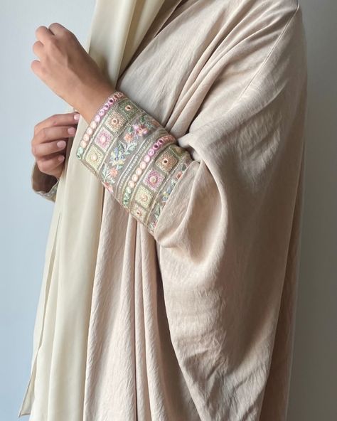 Beige Abaya with embroidered sleeves #abaya #fashion #modestfashion #modestclothing #abayadubai #abayastyle ##ootd #abayaoutfit #hijabers #fyp Pastel Abaya, Traditional Long-sleeve Abaya With Intricate Embroidery, Beige Abaya, Embroidered Floor-length Spring Abaya, Embroidered Hijab, Modest Long Sleeve Embroidered Abaya, Summer Embroidered V-neck Abaya, Bohemian Embroidered V-neck Abaya, Abaya Outfit