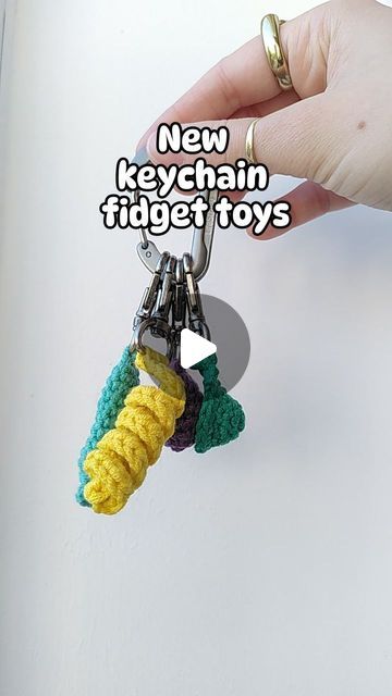 Loui Mitchell on Instagram: "🔑✨KEYCHAIN FIDGETS✨🔑

I've been making the Pushit keychain fidget for a while now, but I've been requested to make a variety of keychain fidgets, so here we are!

-Pushit (marble inside to push up and down)
-Twirlit (twisted yarn fun to stretch and twirl)
-Popit (similar to a mini dimple)
-Squishit (like a stress ball, mine is filled with popcorn kernels!) 

TESTER CALL OUT NOW, PATTERNS AVAILABLE SOON! 😅

#crochet #fidgettoy #marblepusher #pushit #twirlit #popit #minidimple #squishit #stressball #keychain" Diy Fidget Keychain, Fidget Keychain Diy, Fidgets Diy, Crochet Fidget, Popcorn Kernels, Crochet Keychain, Diy Keychain, Fidget Toys, Shoe Storage