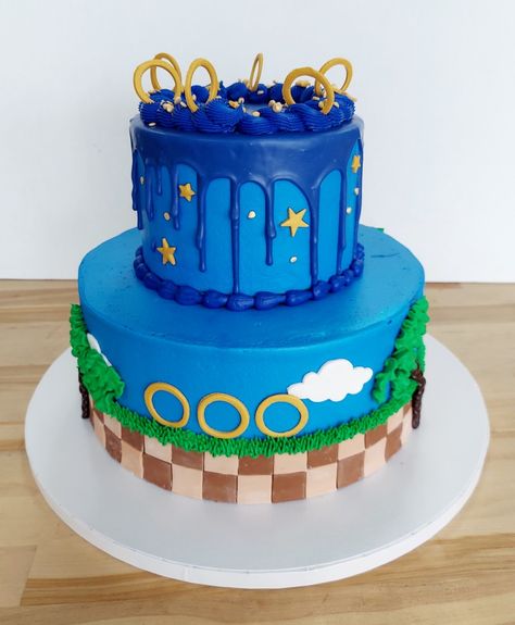 Sonic the Hedgehog themed cake iced in buttercream with fondant design details. *Add store bought figurines at the party so they don't topple over during transportation. #sonicthehedgehog #sonic #customcakes #kids cakes #cakeideas #americandreamcakes #jacksonvillenc Sonic The Hedgehog Theme Party, Sonic The Hedgehog Cake Buttercream, Sonic Drip Cake, Sonic Buttercream Cake, Sonic The Hedgehog Birthday Party Cake, Sonic The Hedgehog Cupcakes, Sonic The Hedgehog Birthday Cake, Sonic Ice Cream, Sonic Cakes