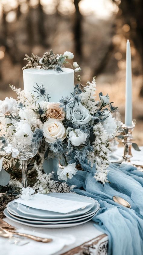 Cozy January wedding ideas with deep winter colors, seasonal flowers, and a winter-themed cake. Winter Wedding Glam, Pink And Blue Winter Wedding, Winter Wedding Light Blue, January Wedding Decor, Winter Fairytale Wedding, Light Blue Winter Wedding, Colors For January, Blue And White Winter Wedding, Dusty Blue Winter Wedding