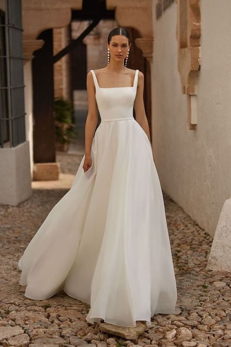 Discover the breathtaking Moonlight Bridal T133, designed for the discerning minimalist bride. This A-line gown boasts a figure-flattering silhouette and a chic square neckline. The satin bodice is complemented by a soft organza skirt that adds an element of romance. Wide straps add a modern touch that perfectly complements this timeless design. #weddingdressinspo #bridalfashion #modernweddingdress Chiffon Wedding Dress A Line, Simple Soft Wedding Dress, Simple Wedding Dress White, Satin Bodice Tulle Skirt Wedding Dress, Wedding Dress Chiffon Skirt, Bride Dress Minimalist, Figure Flattering Wedding Dresses, Wedding Dress For 5ft Bride, Wedding Dresses Medium Length