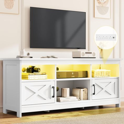 PRICES MAY VARY. Modern Farmhouse TV Stand: Simple and generous home decor is pleasing to the eye, balancing fashion and storage. The classic "X" barn door element design on both sides and simple steel bar door handles add a natural touch. LED Light Entertainment Center: Enhance your TV viewing experience and entertainment ambiance with this TV stand; the integrated LED light strips are available in a variety of colors to create a dynamic atmosphere that matches your mood. TV Media Console Shelf Living Room Media Console, Shelf With Storage, Console Shelf, Farmhouse Tv, Modern Entertainment Center, Farmhouse Tv Stand, Tv Shelf, Television Stands, Media Furniture