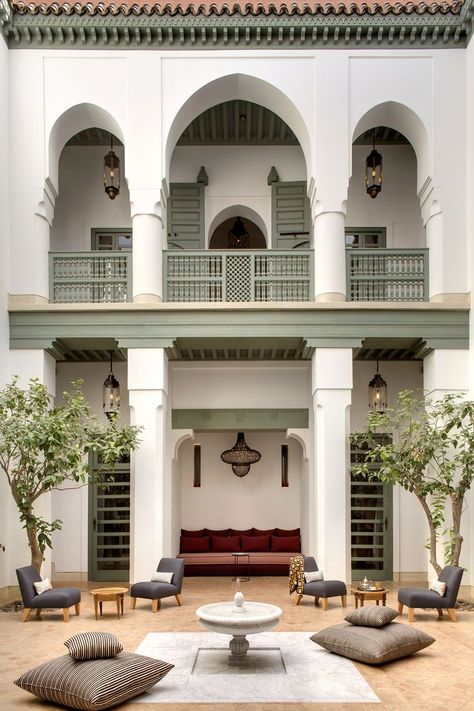 Arches and columns with fountain in the courtyard at Riad Azca, in Marrakech, Morroco #lecollectionist #luxuryhomes #homedesign #homeexterior #houseexterior #moroccaninteriors #moroccandecor Ocean Inspired Bedroom, Moroccan Courtyard, Moroccan Hammam, Moroccan Houses, Moroccan Riad, Riad Marrakech, Classic House Exterior, House Design Exterior, Marrakech Morocco