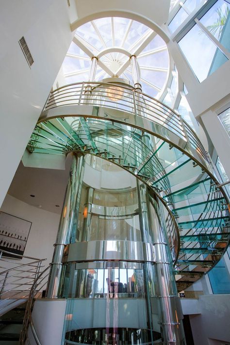 Luxury Waterfront Home with Round Glass Elevator and Spiral Staircase - St. Petersburg, Florida Spiral Glass Staircase, Circular Elevator, Stairs Elevation, Round Elevator, Staircase Slide, Round Stairs, Glass Architecture, Stair Elevator, Luxury Staircase