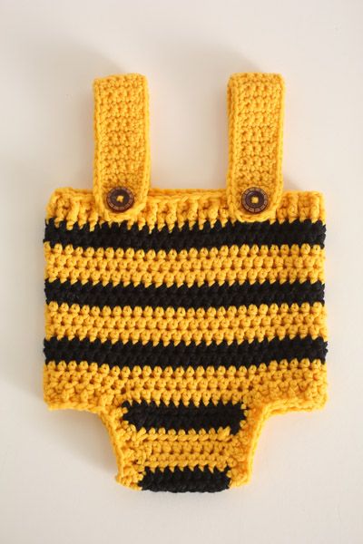 What better way to celebrate baby's first Halloween than with an adorable bumble bee outfit! The hat and playsuit each feature black and yellow stripes running down them to create the perfect bumble bee effect! The hat features two large antenna, while the playsuit features a ribbed section and two straps to achieve a snug fit around baby's waist! Crochet Bee Costume, Crochet Baby Romper Free Pattern, Baby Bumble Bee Costume, Bumble Bee Outfit, Baby Bee Costume, Bee Outfit, Crochet Baby Romper, Bumble Bee Costume, Crochet Baby Costumes