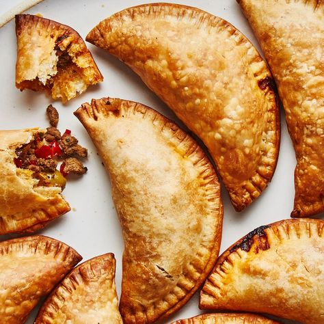 There are as many variations of empanadas as there are cooks in Argentina. This version was developed by BA Test Kitchen Manager Gaby Melian, who is from Buenos Aires and was taught as a little girl by family members how to make them. After years of perfecting her method, she prefers the empanadas baked, not fried, and the addition of green olives and raisins in the filling is essential. Baked Empanadas, Beef Empanadas Recipe, Chicken Empanadas, Frozen Beef, Beef Empanadas, Puff Pastry Dough, Empanadas Recipe, Pastry Dough, Filling Recipes