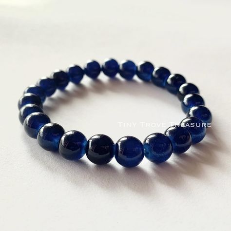 The Midnight Blueberry Bracelet… Blue Stretch Glass Bracelet- Classic Glass Round Bracelet 8mm - Unisex, Blue, Glass Bracelet Experience timeless elegance with our meticulously crafted Classic Blue Glass Bracelet, boasting captivating shades reminiscent of tranquil ocean waves. Elevate your style effortlessly with this exquisite accessory. - Classic Blue Glass Beaded Bracelet - Crafted with 8mm glass beads - Elastic design for comfort and style - Expresses unique personality effortlessly ... Blueberry Bracelet, Round Bracelet, Glass Beaded Bracelet, Bracelet Blue, Glass Bracelet, The Midnight, Glass Beaded Bracelets, Bracelet Crafts, Classic Blue