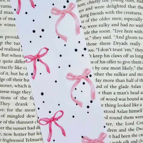 New bookmark design! Are you wearing bows this summer? I see them everywhere right now 🎀 This bookmark features a repeating pattern of two pink bows on a white background with black splatter. Double-sided and laminated, too! 🤓📚 #bow #bows #trending #trendy #trend #bookmark #bookmarks #bookmarkart #books #reader #reading #ilovereading #lovetoread #bookmarkcollection #bookishgifts #entrepreneur #handmade #handmadegifts #shop #shopsmall #smallbusiness #smallbusinessowner #craft #crafts #cr... Bookmark Design, Pink Bows, I Love Reading, Bookish Gifts, Repeating Patterns, Pink Bow, Small Shop, This Summer, White Background