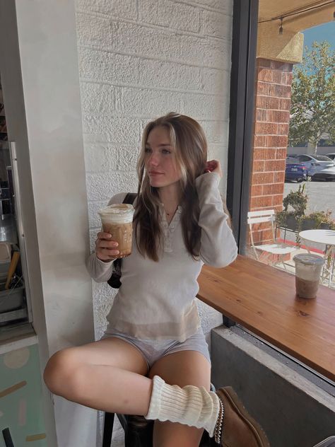 leg warmers autumn fall vibes coffee shop aesthetic study aesthetic iced coffee ugg tasman Tasman Uggs And Leg Warmers, Coffee Shop Poses, Coffee Shop Pics, Autumn Coffee Shop, Coffee Shop Photoshoot, Aesthetic Iced Coffee, Coquette Clothing, Fall Girl, Aesthetic Study