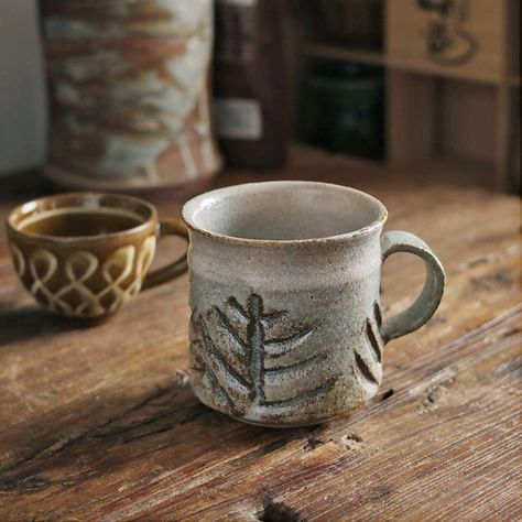 Embrace the warmth of handcrafted pottery. This rustic, vintage-style coffee mug, perfect for tea or coffee, adds character to your mornings and cozy evenings. Feel the unique texture and appreciate the subtle, earthy tones of this artisan-made piece. Enjoy your favorite beverage in style all year round. Handcrafted Pottery, Tea Cups Vintage, Tea Or Coffee, Handmade Ceramic, Earthy Tones, Ceramic Coffee Mug, Handmade Ceramics, Tea Cup, Drinkware