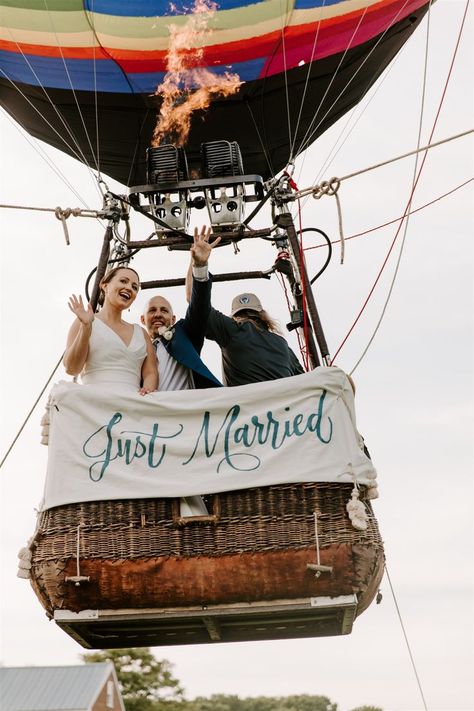 Custom hand painted "Just Married" sign displayed on the hot air balloon! Love Is In The Air Aesthetic, Wedding Hot Air Balloon, Balloon Engagement Pictures, Hot Air Balloon Wedding Theme, Ravenswood Mansion, Hot Air Balloons Photography, Hot Air Balloon Wedding, Wedding Theme Color Schemes, Wedding Table Seating Chart