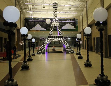 30' Eiffel Tower and balloon lamp posts created  for an evening in Paris themed dance. Masquerade In Paris Theme, Paris Themed Decorations, Paris Lamp Post, Night In Paris Dance Theme, An Evening In Paris Theme Party, Paris Themed Dance, Paris Prom Theme Decorations, Night In Paris Homecoming, A Night In Paris Prom Theme