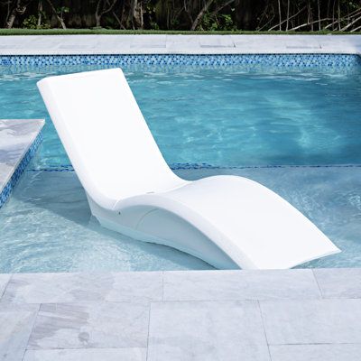 Bring sleek style and comfort from the patio to the pool with the Vero Lounger Tall. The ergonomic design of this outdoor lounger is optimized to provide superior relaxation whether used around the pool’s perimeter or in up to 15 in. (38.1 cm) of water. When used on a tanning ledge or sun shelf, the base will fill with water to securely anchor the chair and keep it from floating when not in use. Plus, when used outside of the pool, the extra height makes it easier to get in and out of the chair. Plastic Pool Lounge Chairs, Pool Lounge Chairs In Water, Pool Water Chaise Lounge Chairs With Canopy For Adults, Pool Lounge Chairs Sun Lounger, Outdoor Pool Furniture, Pool Loungers, White Plastic Pool Lounge Chairs, Sun Shelf, Ledge Lounger